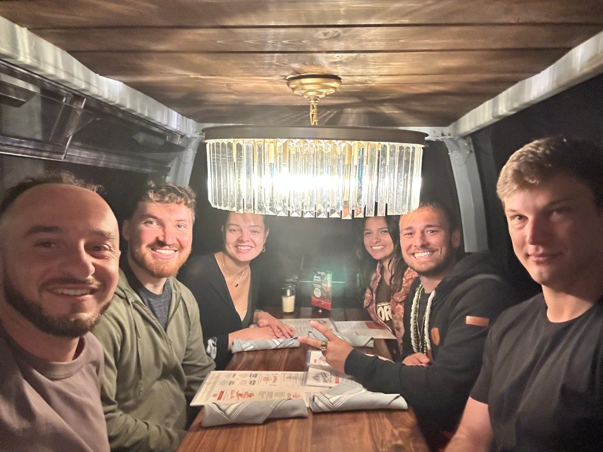Squeezed into a booth for dinner
